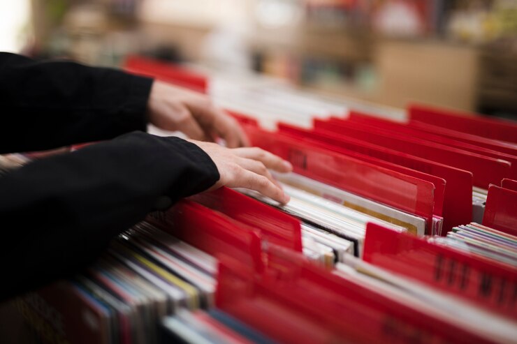 close-up-young-man-looking-vinyls-store